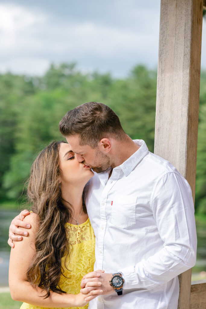 Newly Engagement couple kissing during engagement photo shoot in RI