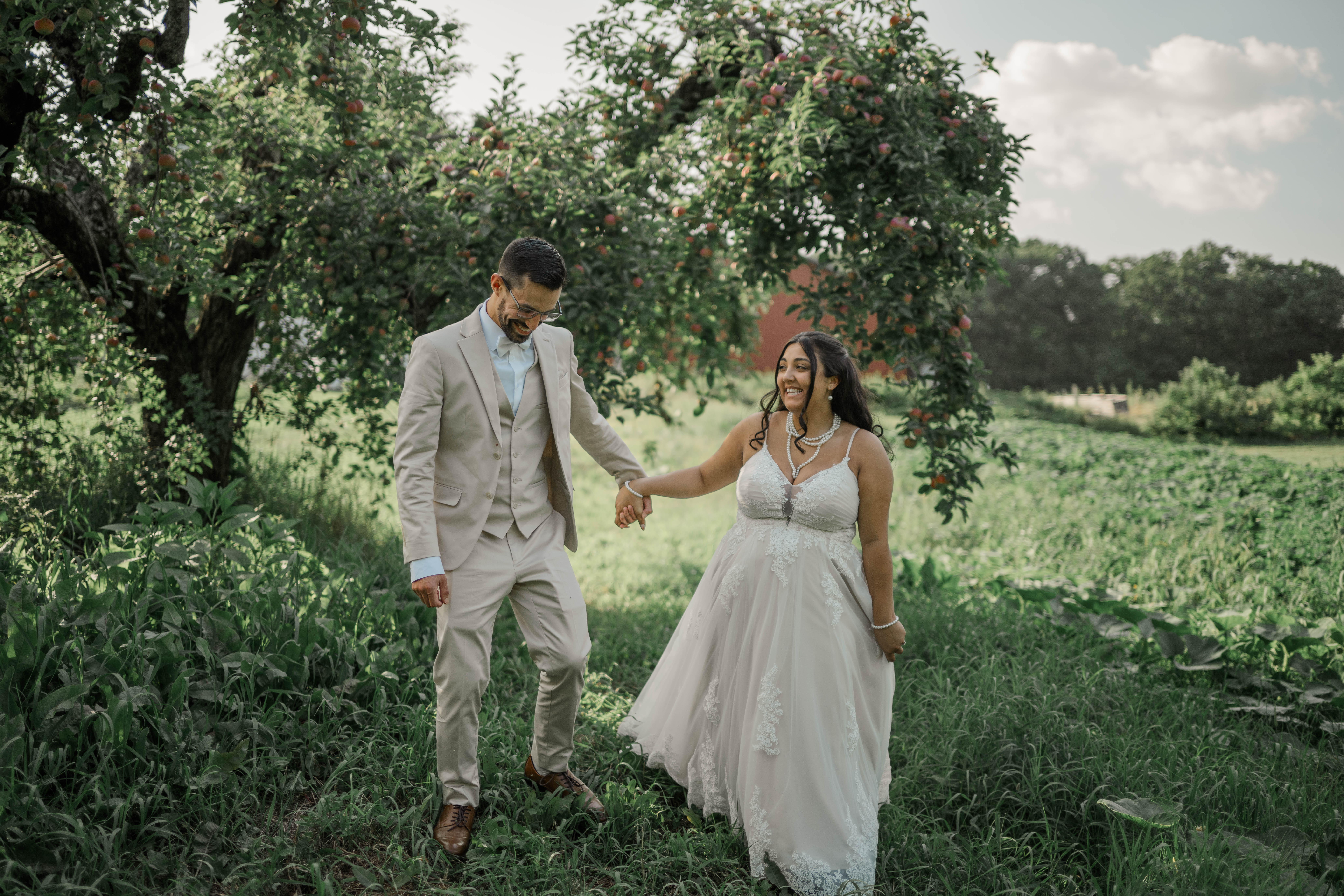 Wedding portrait of couple in secluded orchard at Legacy Venue at Barden Family Orchard